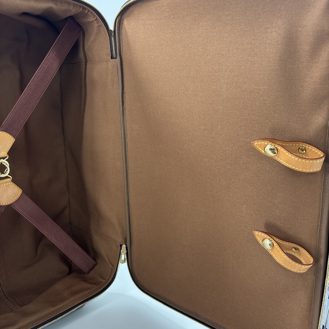 Louis Vuitton M23294 Monogram Pegase 55 carry-on suitcase in brown.
