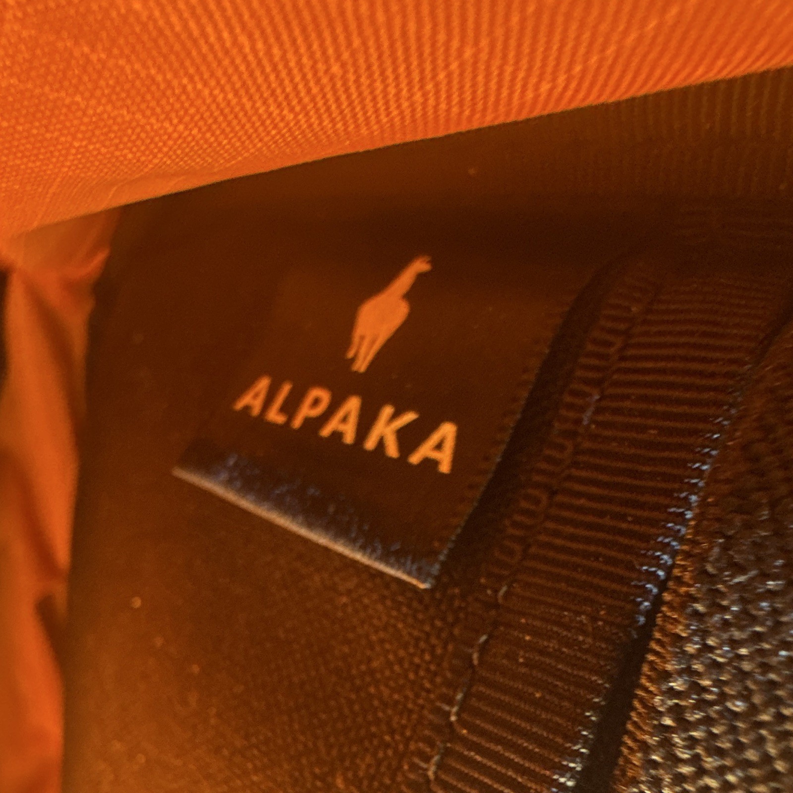 ALPAKA Black Crossbody Sling Bag, Orange Lined, Zip, Adjustable Strap Pockets