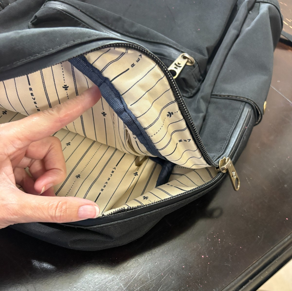 Revelry Water Resistant Black Tan Backpack Zipper needs repair see description