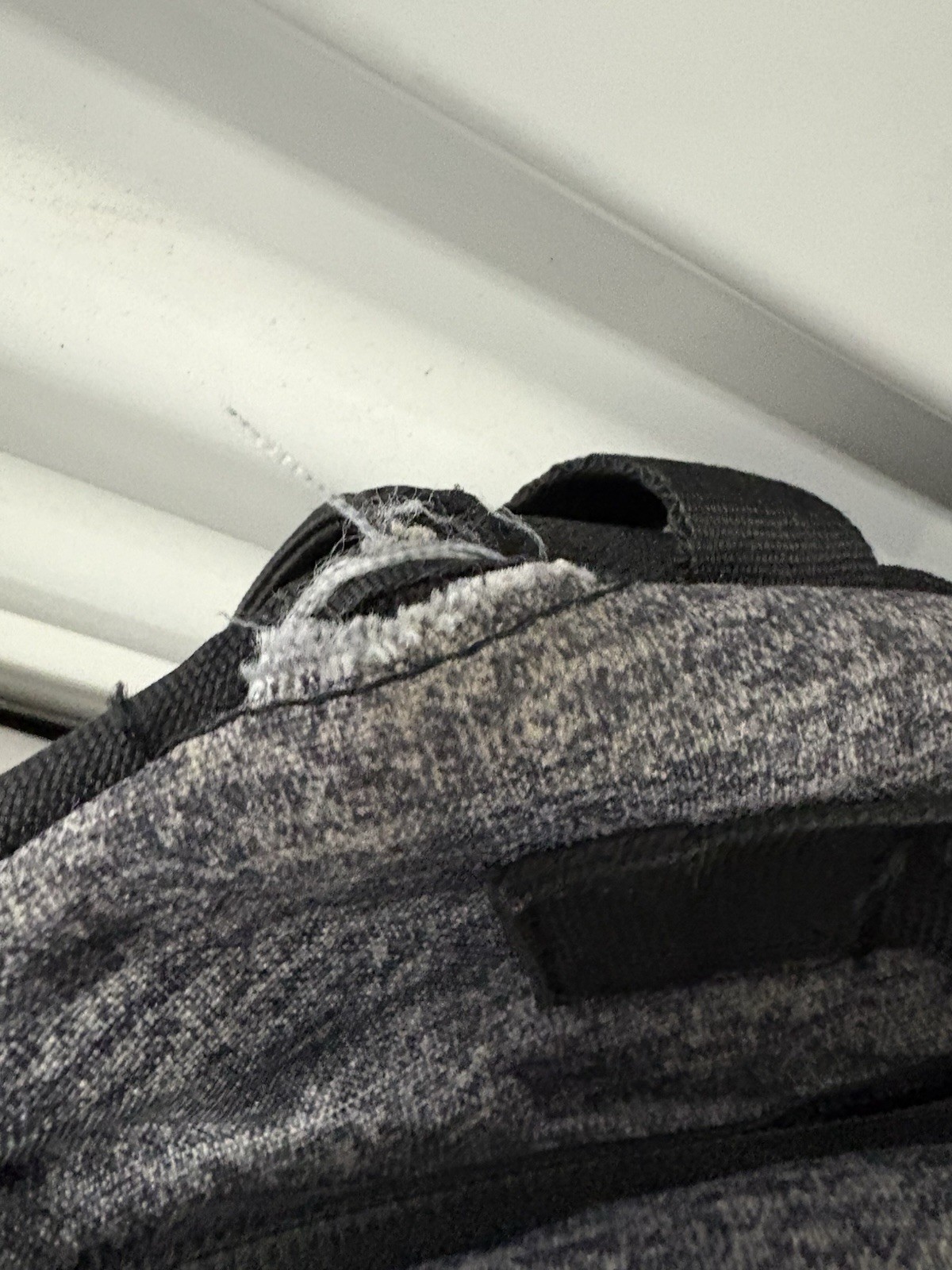 Adidas Defender backpack in grey heather material with black accents.