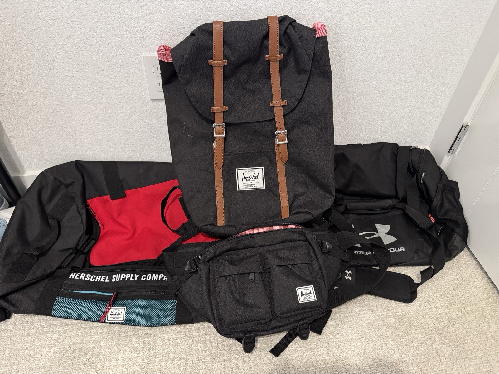 3 Herschel Supply Co. Bags and 1 Underarmor Bag