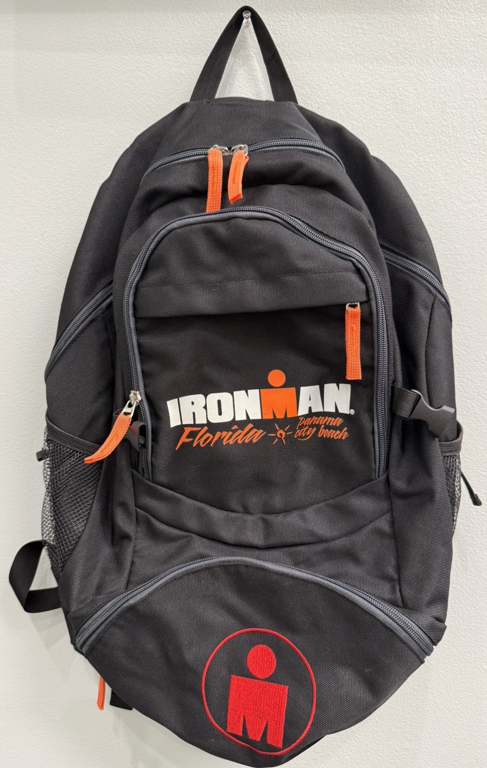 Ironman Triathlon FL Panama City Beach athlete backpack iconic red M-dot logo