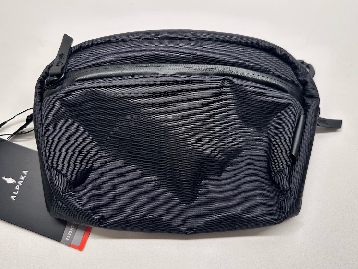 NEW Alpaka Flight Sling 1L Recycled Fabric Crossbody Bag Travel Black NWT