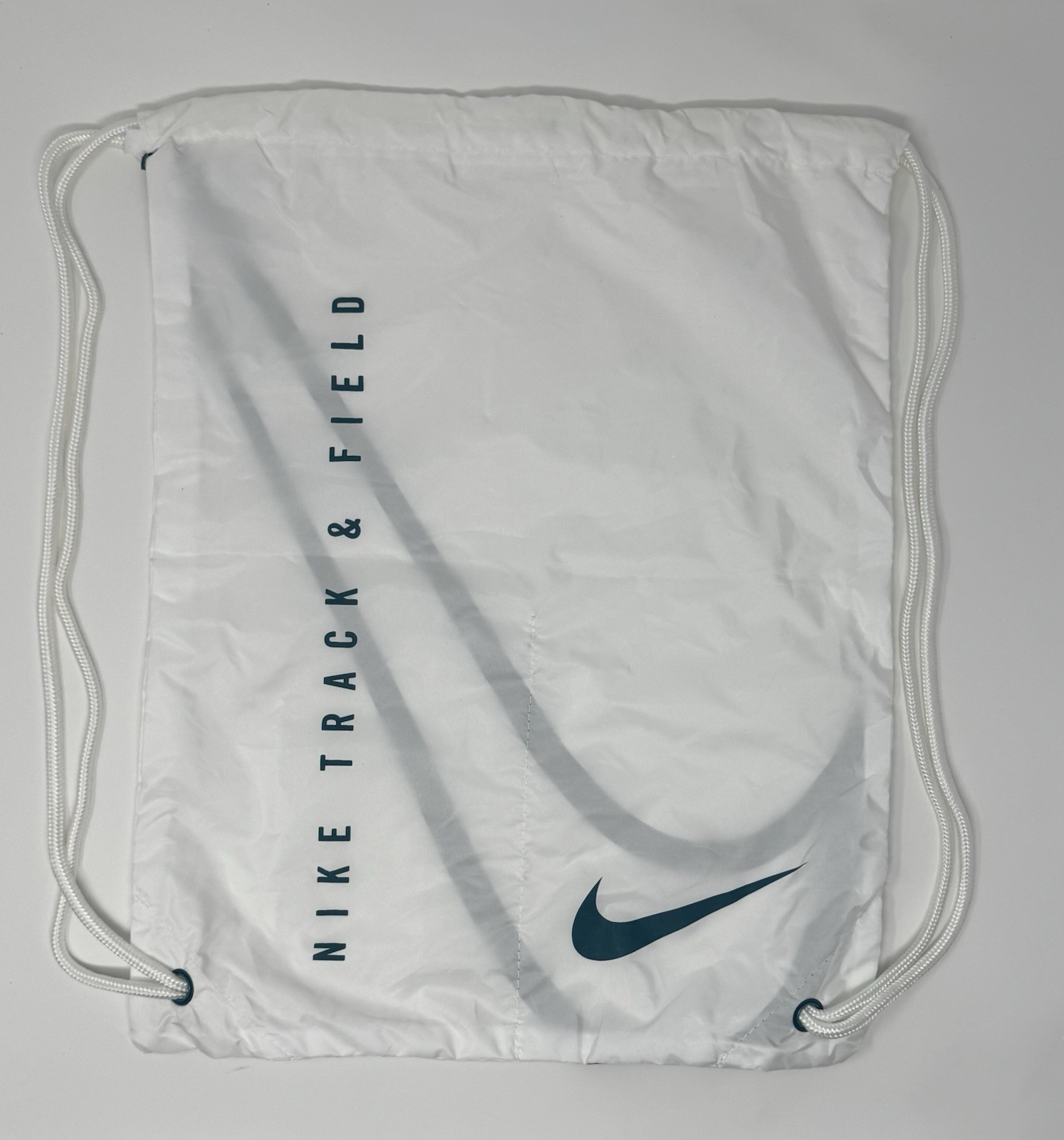 Nike Track & Field Spikes Shoe Drawstring Tote Bag in white and spruce green