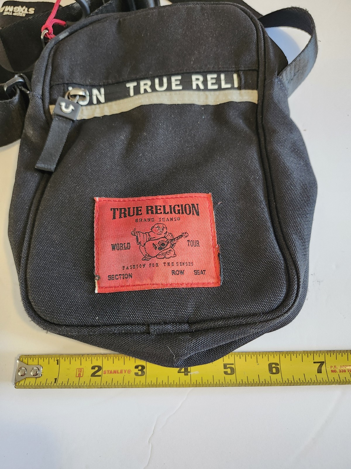 True Religion Black Messenger Bag Adjustable Strap Inner Pockets Buddha Logo