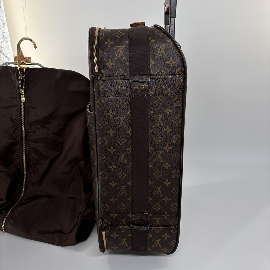 Louis Vuitton M23294 Monogram Pegase 55 carry-on suitcase in brown.