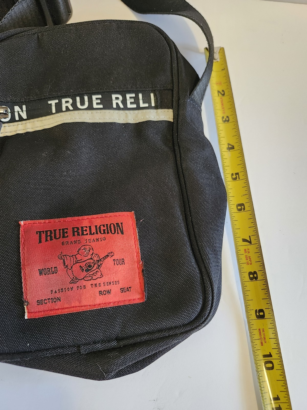 True Religion Black Messenger Bag Adjustable Strap Inner Pockets Buddha Logo