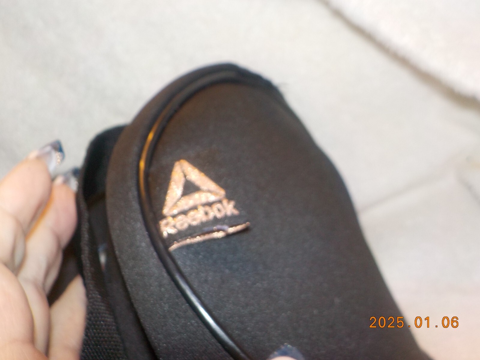 Reebok small black barrel style bag with wrist strap and carry handle