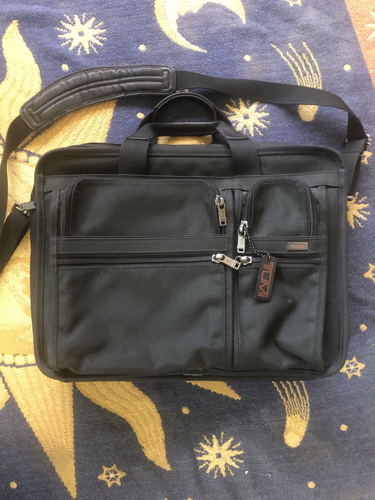 TUMI Model Number: 26041D4 Expandable Organizer Nice condition with shoul strap