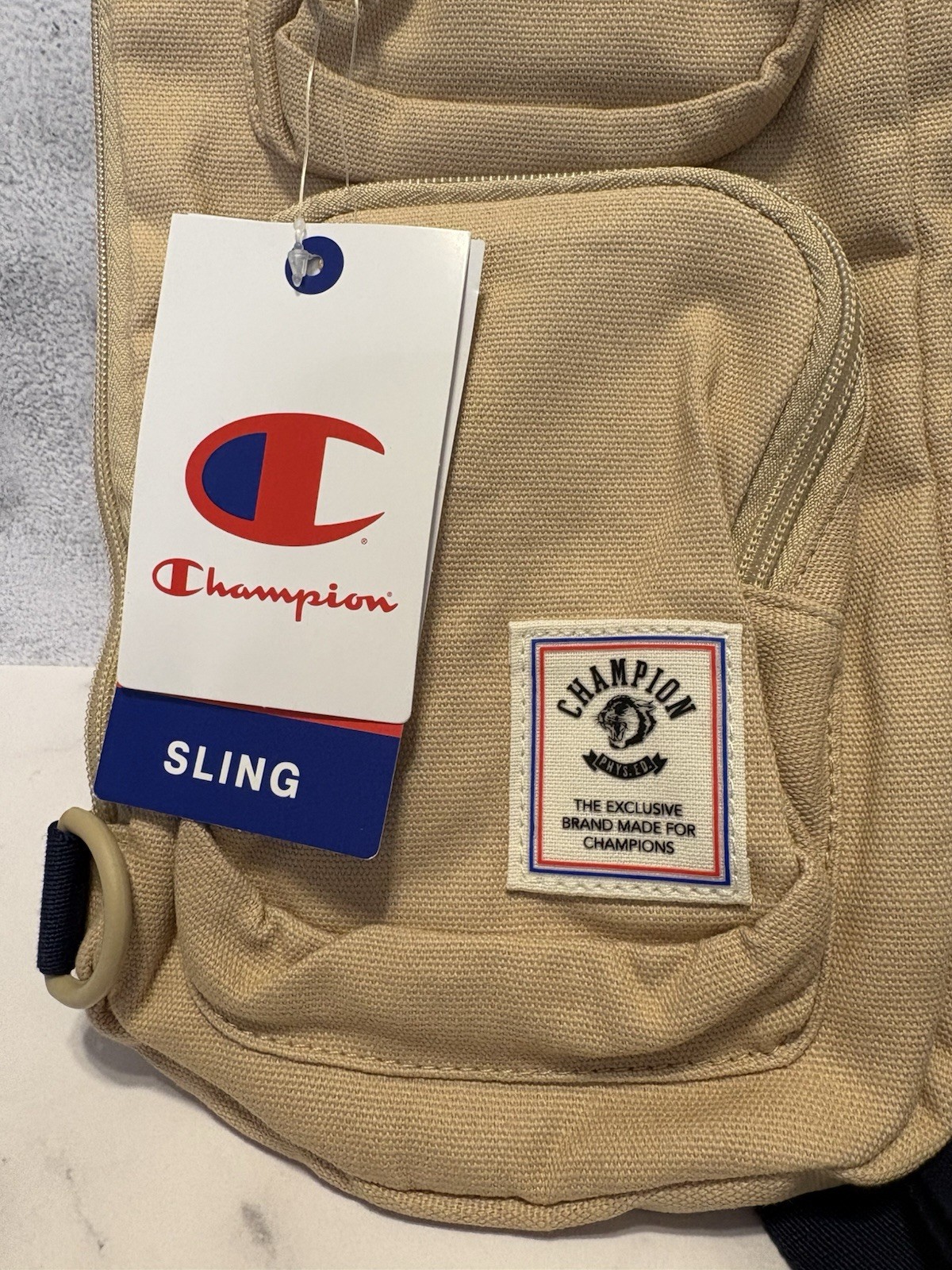 Champion Canvas Sling Back Bag In Tan/Khaki NWT