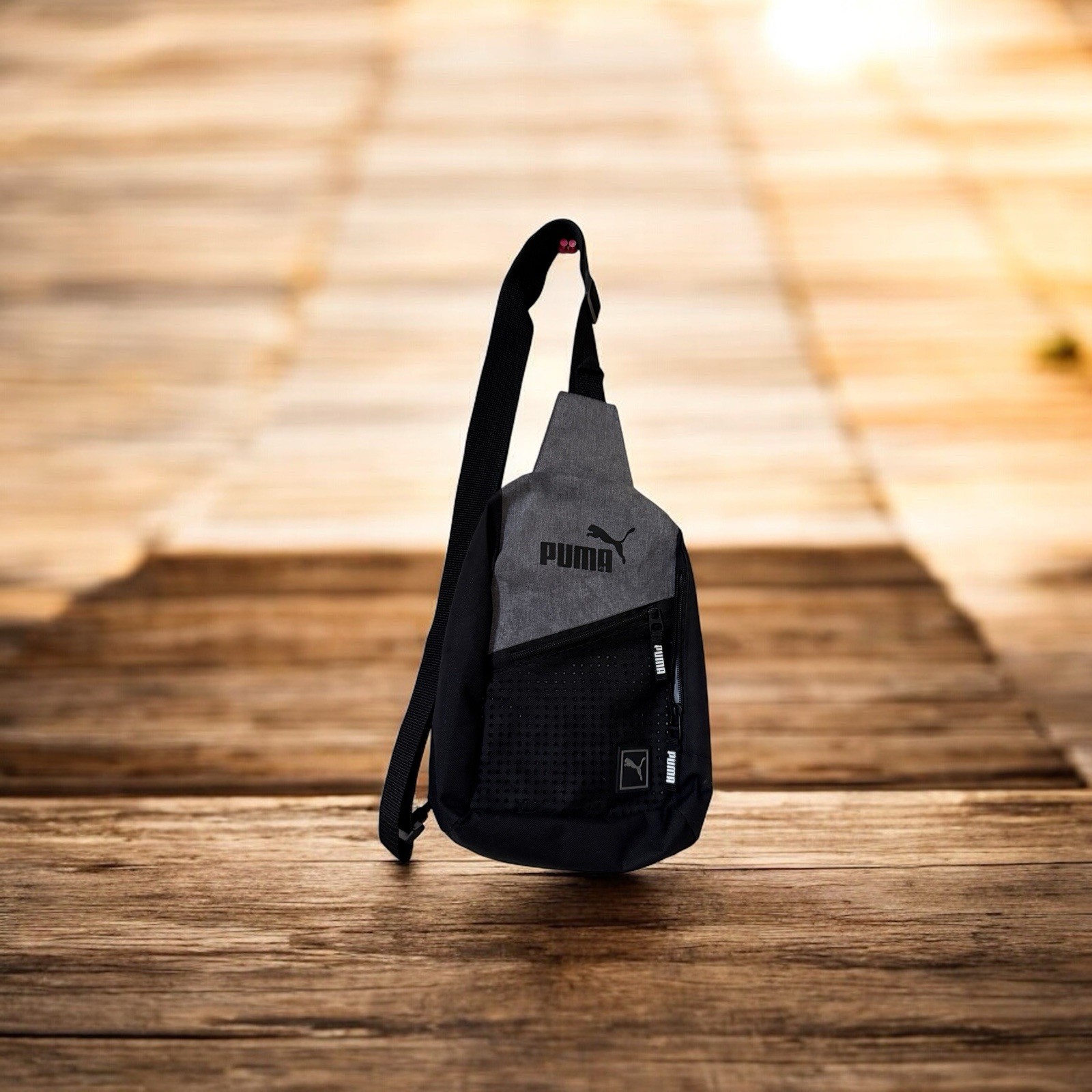 Puma Evercat Sidewall Sling Backpack in black and heather grey.
