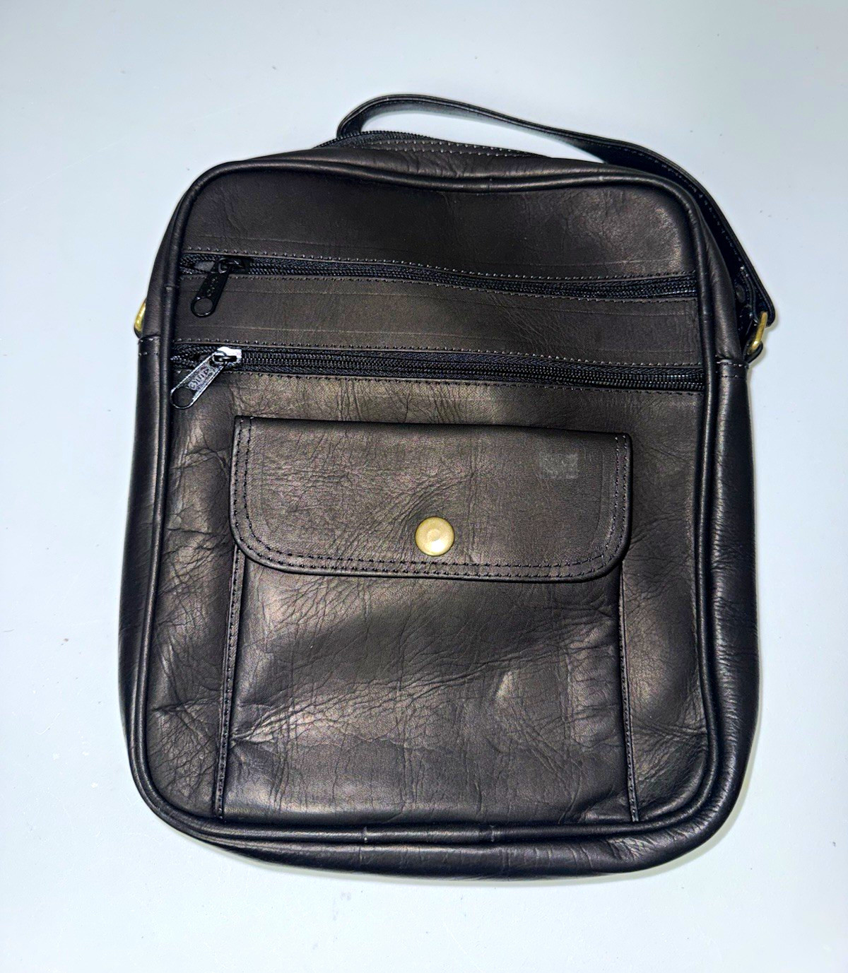Genuine leather Blk + body Adjustable Strap Pockets/zip closure. Made in ecuador