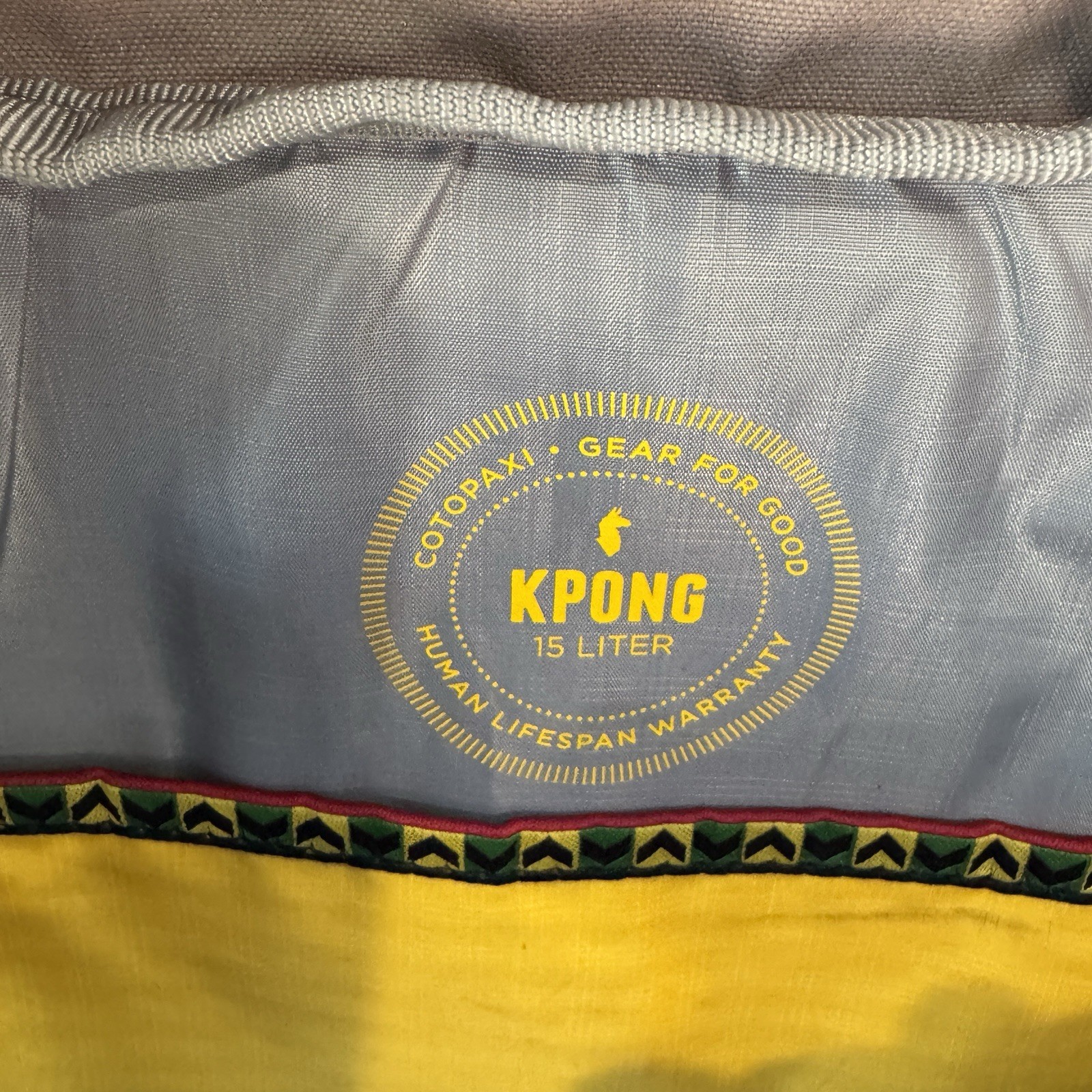 Cotopaxi computer messenger bag. Lots of pockets and company embroidered, Tan