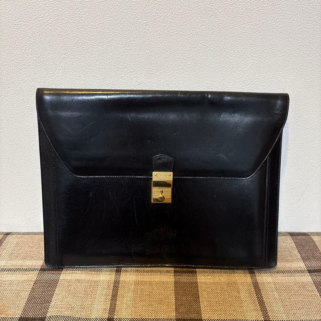 Bally Men’s Black Leather Flap Bag Gold hardware Lock authentic Size 37x28x5cm