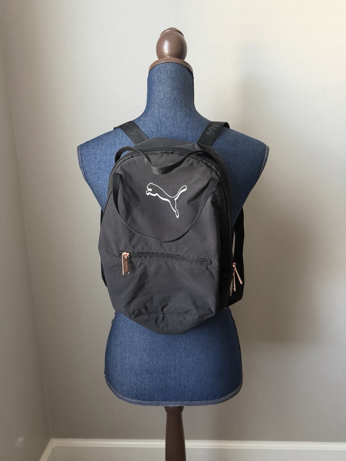 small black puma backpack w/ rose gold hardware