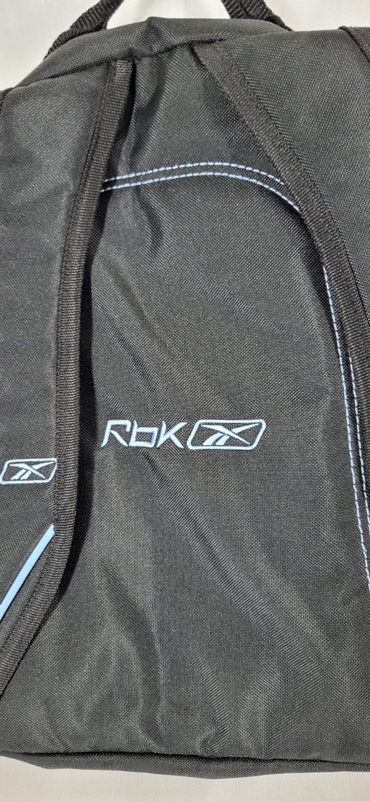 black and blue Reebok backpack