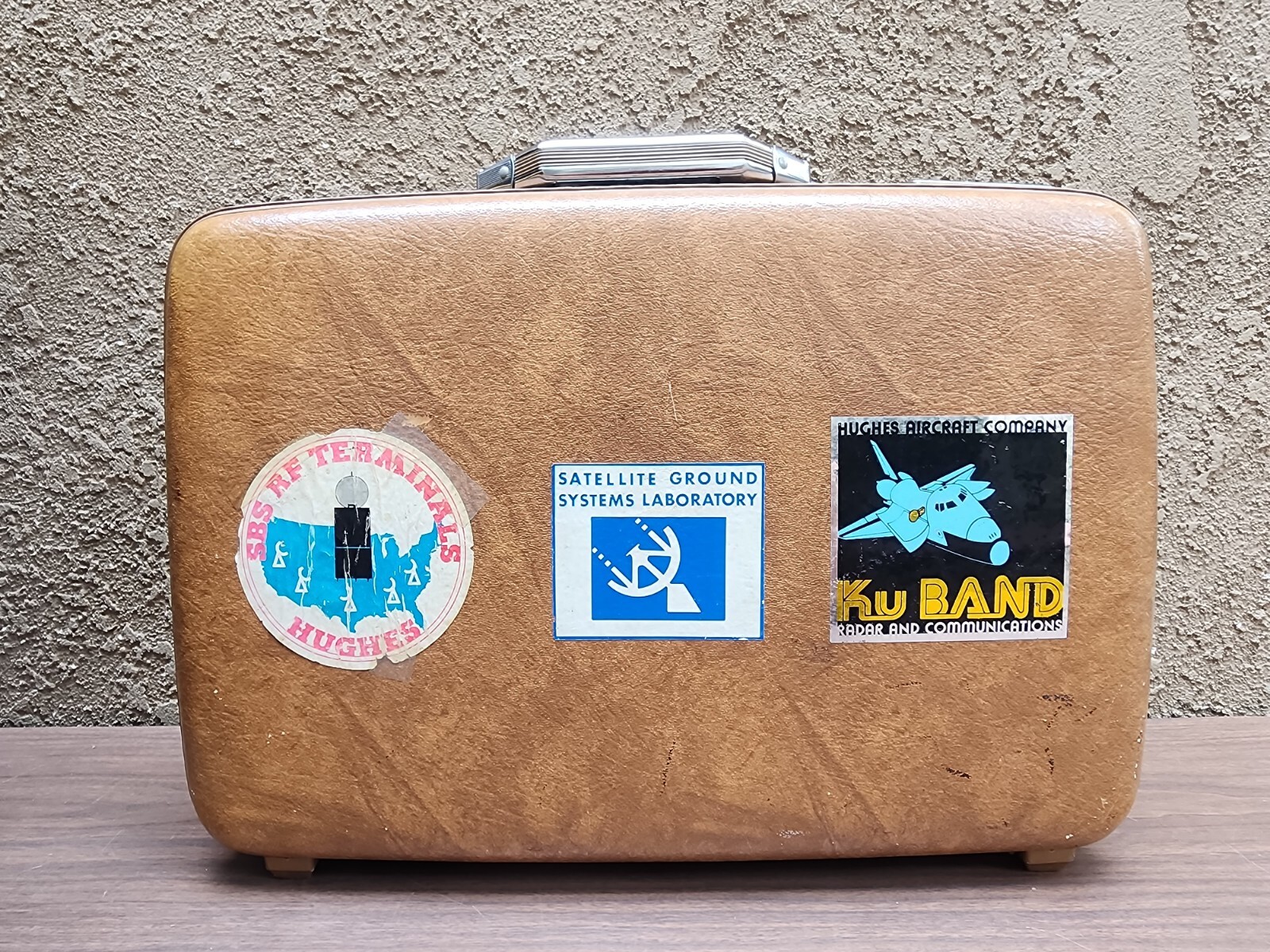 American Tourist Escort Briefcase with Vintage Hughes Aircraft stickers