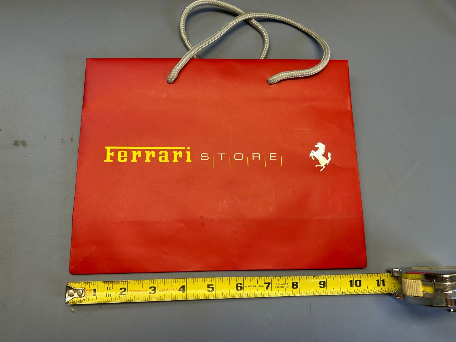 Authentic FERRARI STORE Red Shopping gift bag 10″ x 8.25″ x 3.25″. Used.