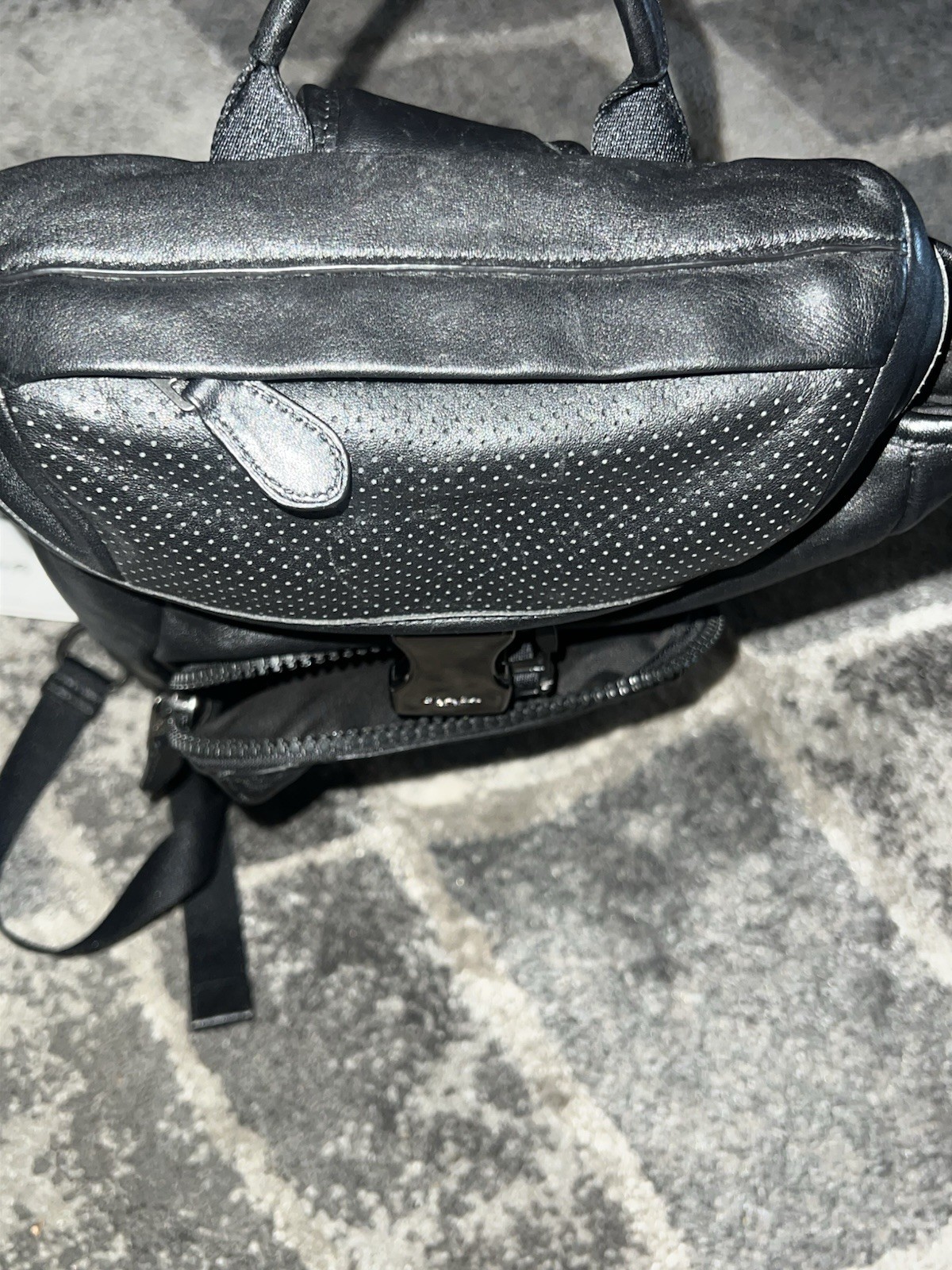 Coach Leather Sling Backpack well-organized, hands-free style, sleek design