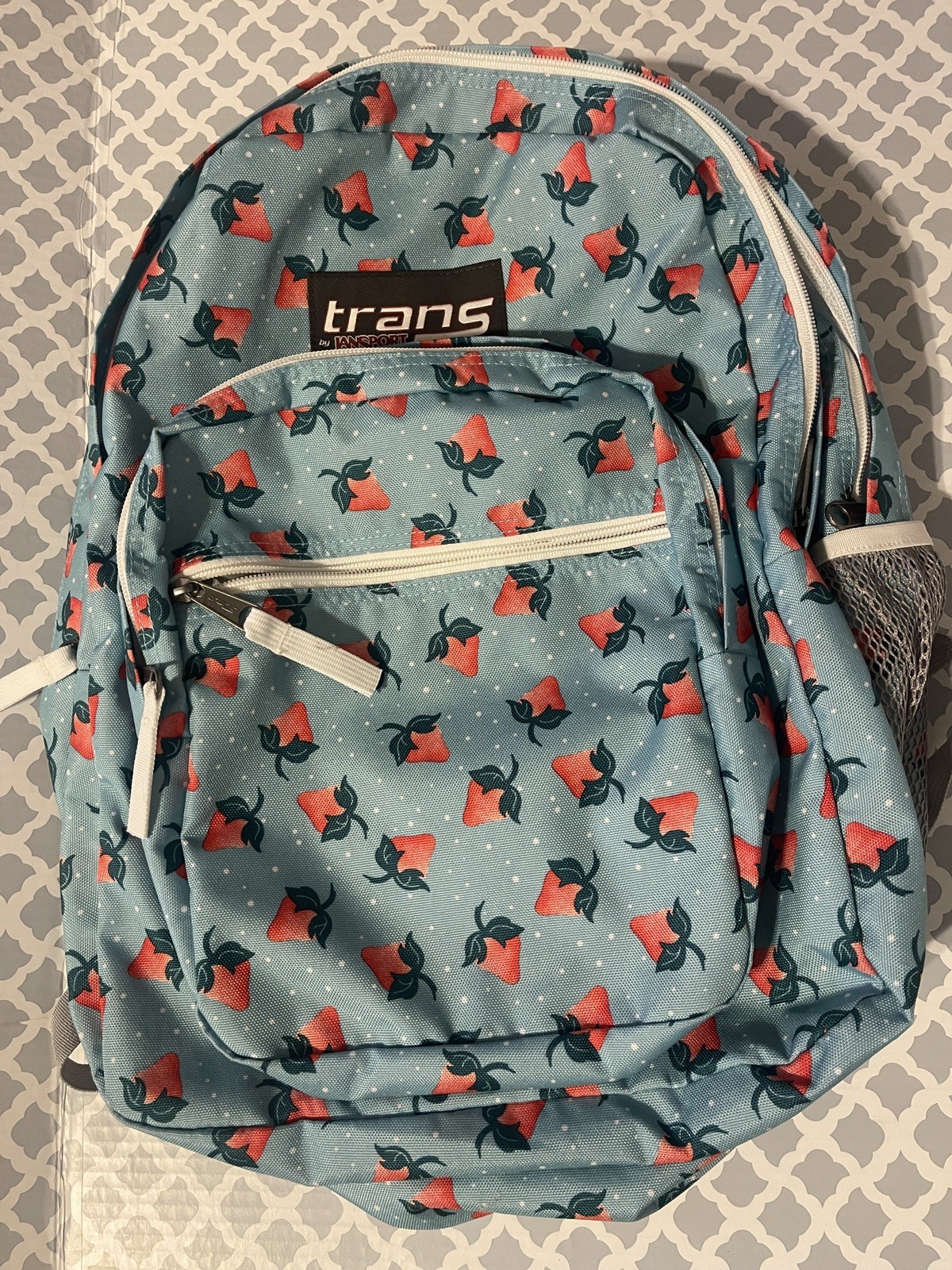 Trans by Jansport Teal Strawberry and Polkadot print Backpack