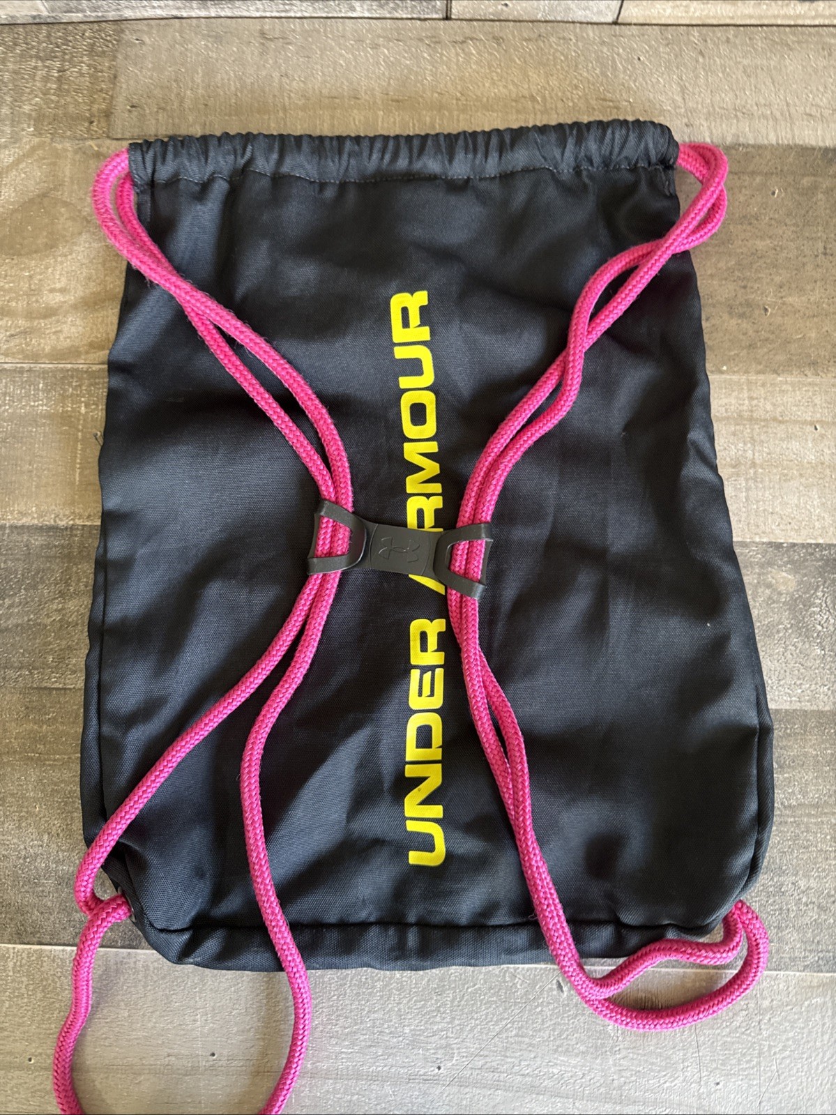 Pre- owned Black Under Armour Draw String Gym Bag with Pink and Yellow logo