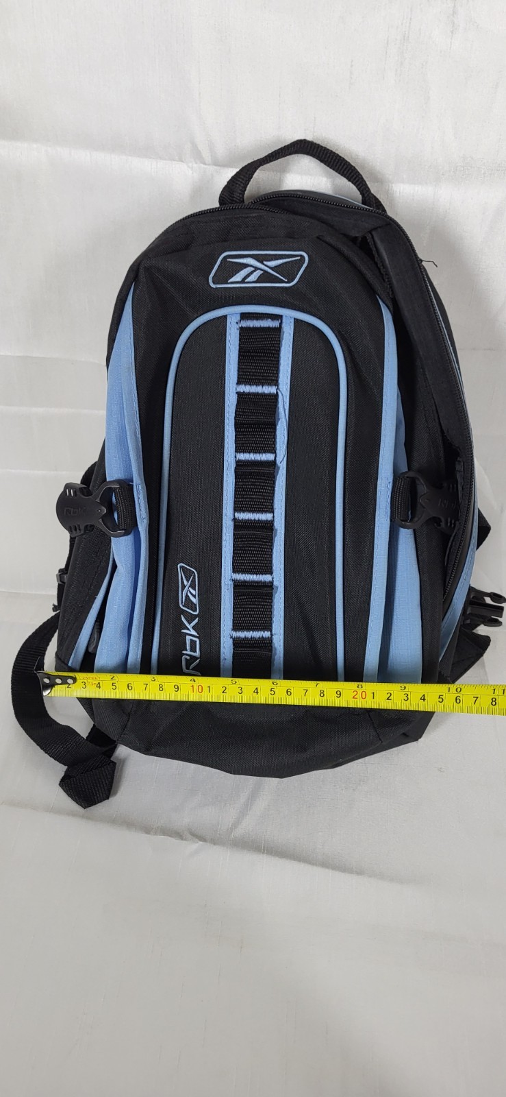 black and blue Reebok backpack