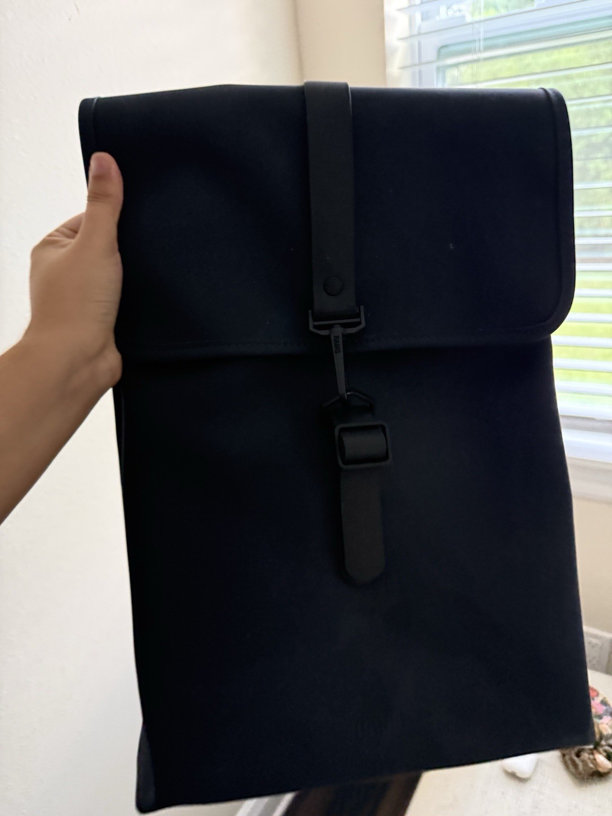 Rains Black Waterproof Roll-Top Backpack with Front Buckle Closure