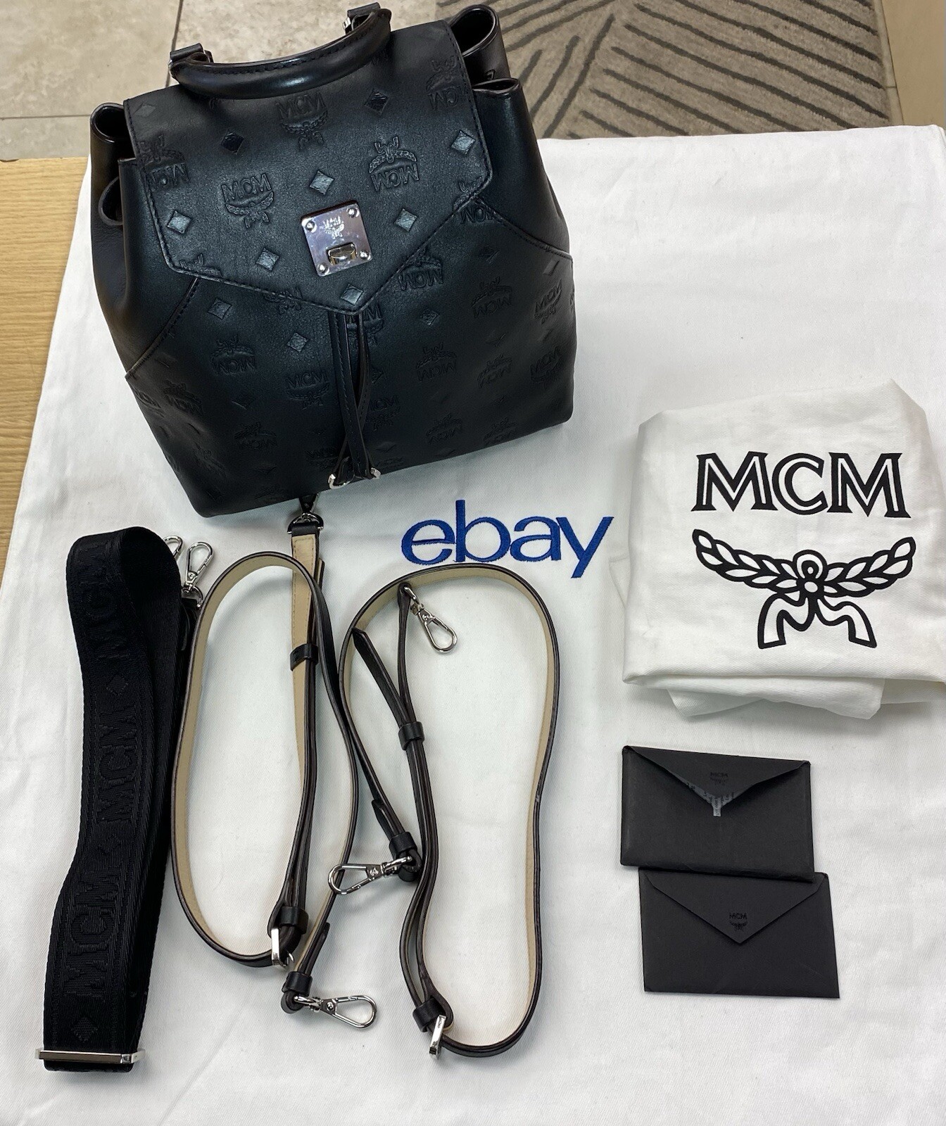 MCM Essential Monogram Leather Small Backpack In Charcoal 10×8.5×4.5 Dark Brown