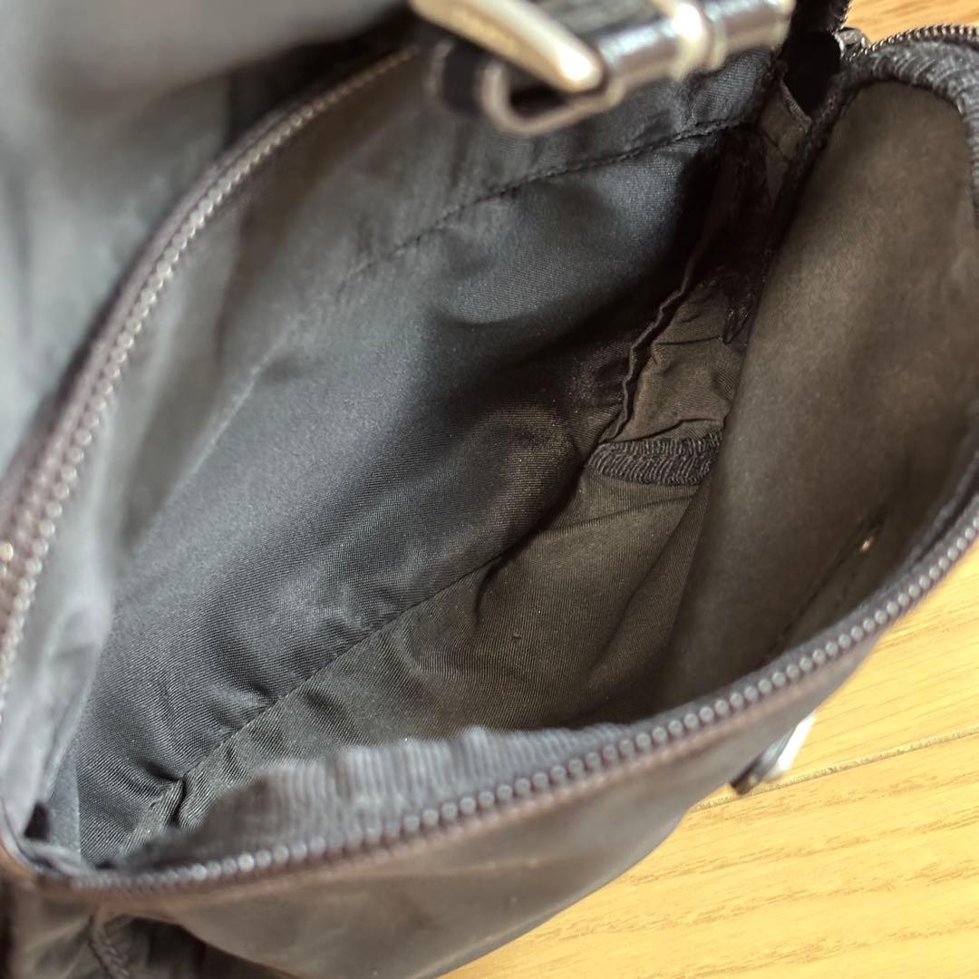 Prada Rucks Saffiano Triangular Plate