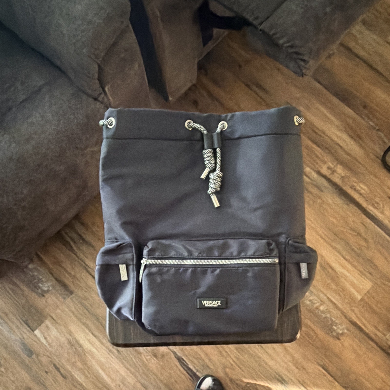 Versace Black Drawstring Backpack w/ Front Zip Pocket, Adjustable Straps