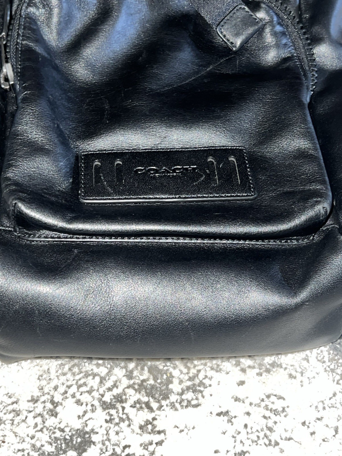Coach Leather Sling Backpack well-organized, hands-free style, sleek design