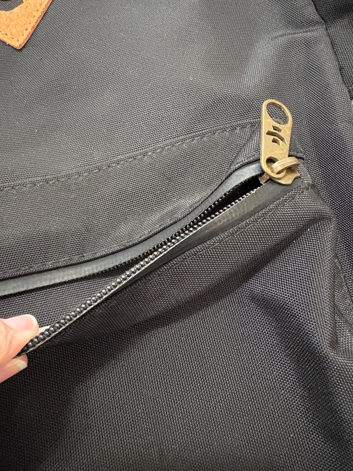 Revelry Water Resistant Black Tan Backpack Zipper needs repair see description