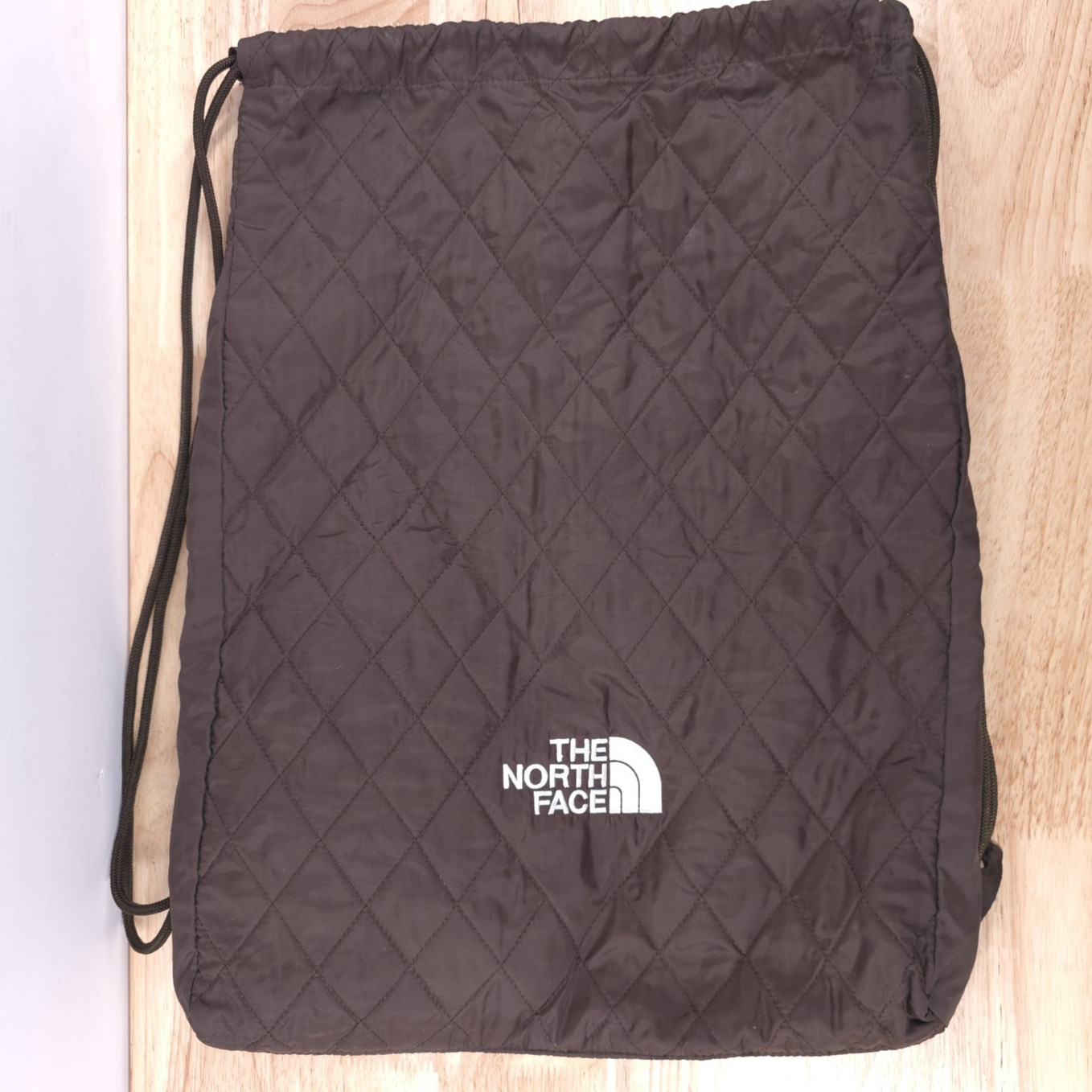 The North Face Quilted Drawstring Bag — Brown