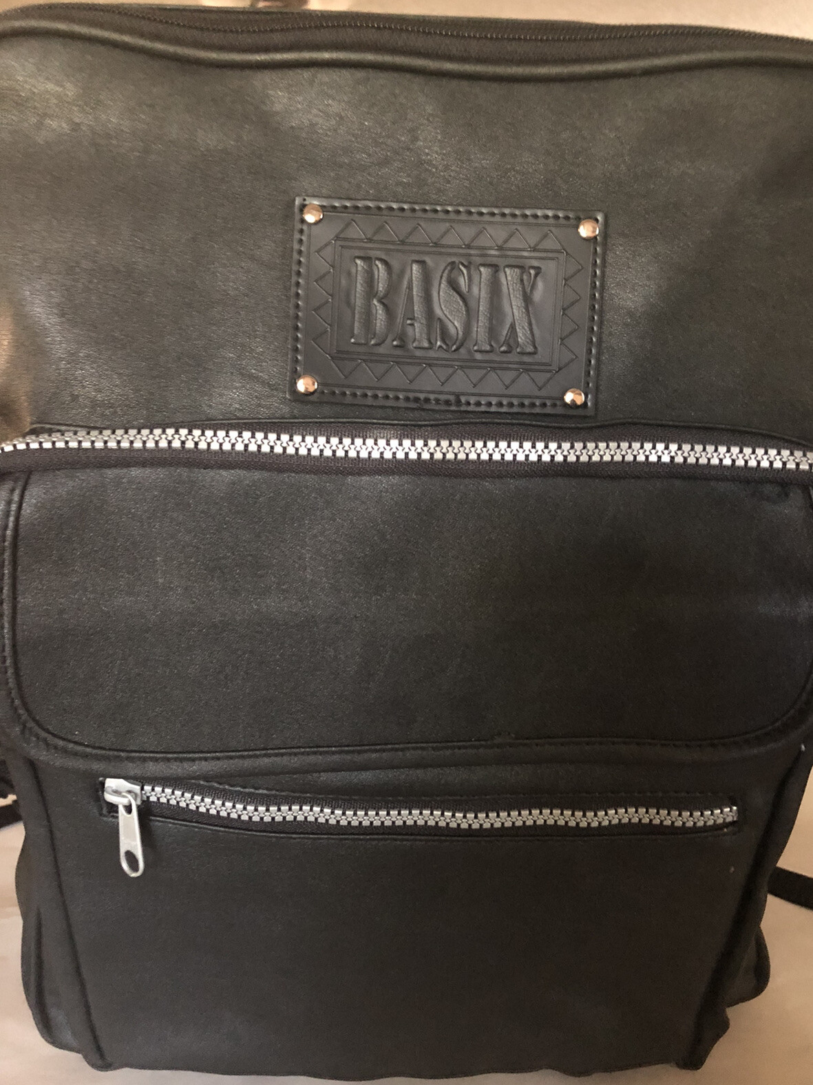 Basix backpack, Black Vinyl w/ 3 Strong Zippered And Two Open Side Compartments