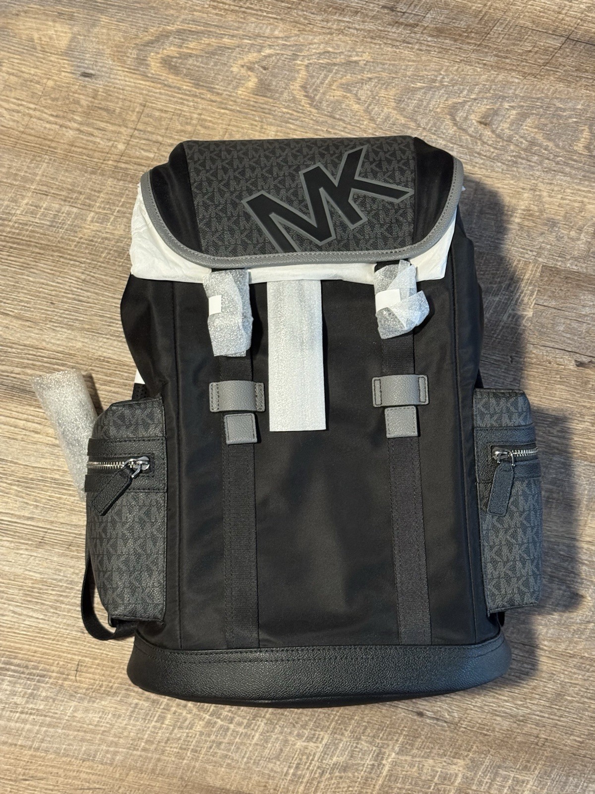 Michael Kors Logo Monogram Backpack (Black/Gray), Flap Closing and Zip Pockets