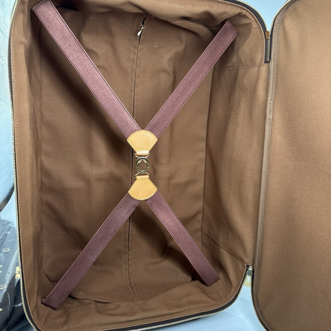 Louis Vuitton M23294 Monogram Pegase 55 carry-on suitcase in brown.