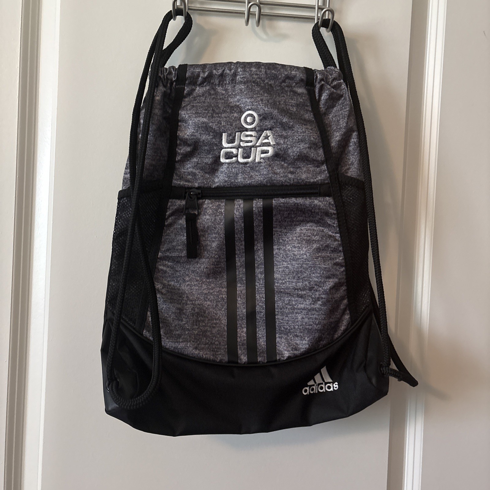 Adidas Alliance Sackpack In Heather Gray, And Black With USA CUP Logo On It.