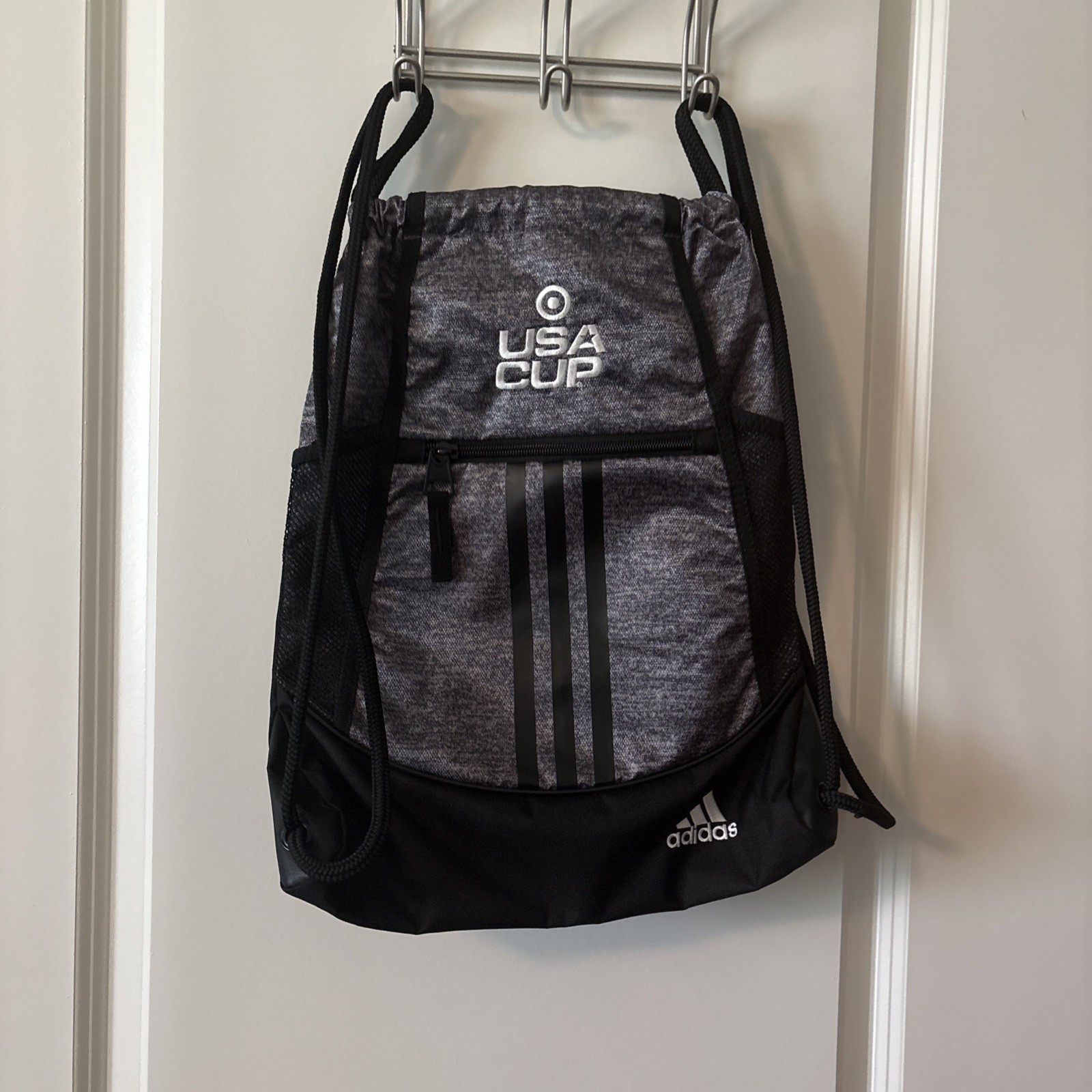 Adidas Alliance Sackpack In Heather Gray, And Black With USA CUP Logo On It.