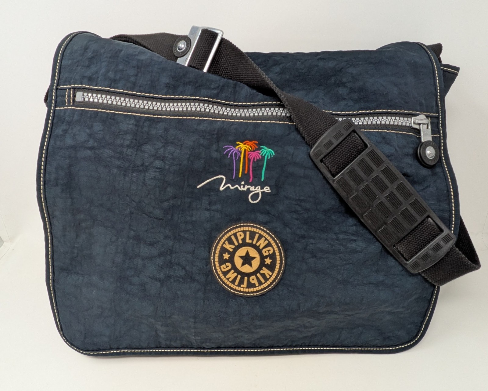 Kipling Madhouse Postman Bag Mirage Las Vegas Logo Expandable Messenger Bag Blue