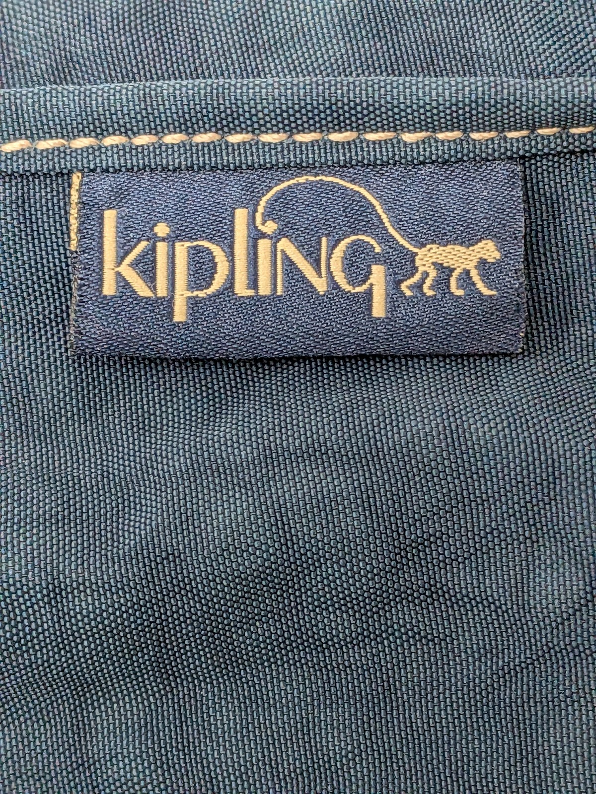 Kipling Madhouse Postman Bag Mirage Las Vegas Logo Expandable Messenger Bag Blue