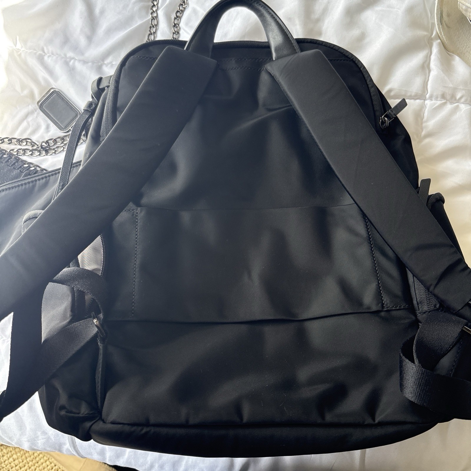 TUMI Black Backpack, Zip Closure, Adjustable Straps, Pockets, Top Handle