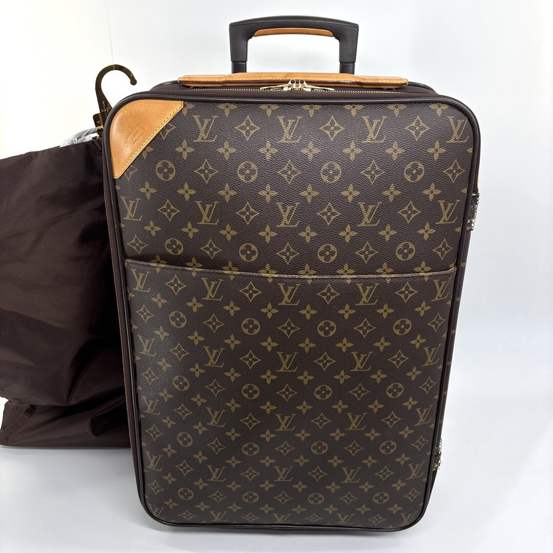 Louis Vuitton M23294 Monogram Pegase 55 carry-on suitcase in brown.