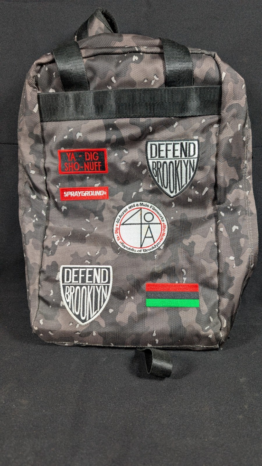 Sprayground Spike Lee Patches Backpack in a black camo pattern Limited Edition