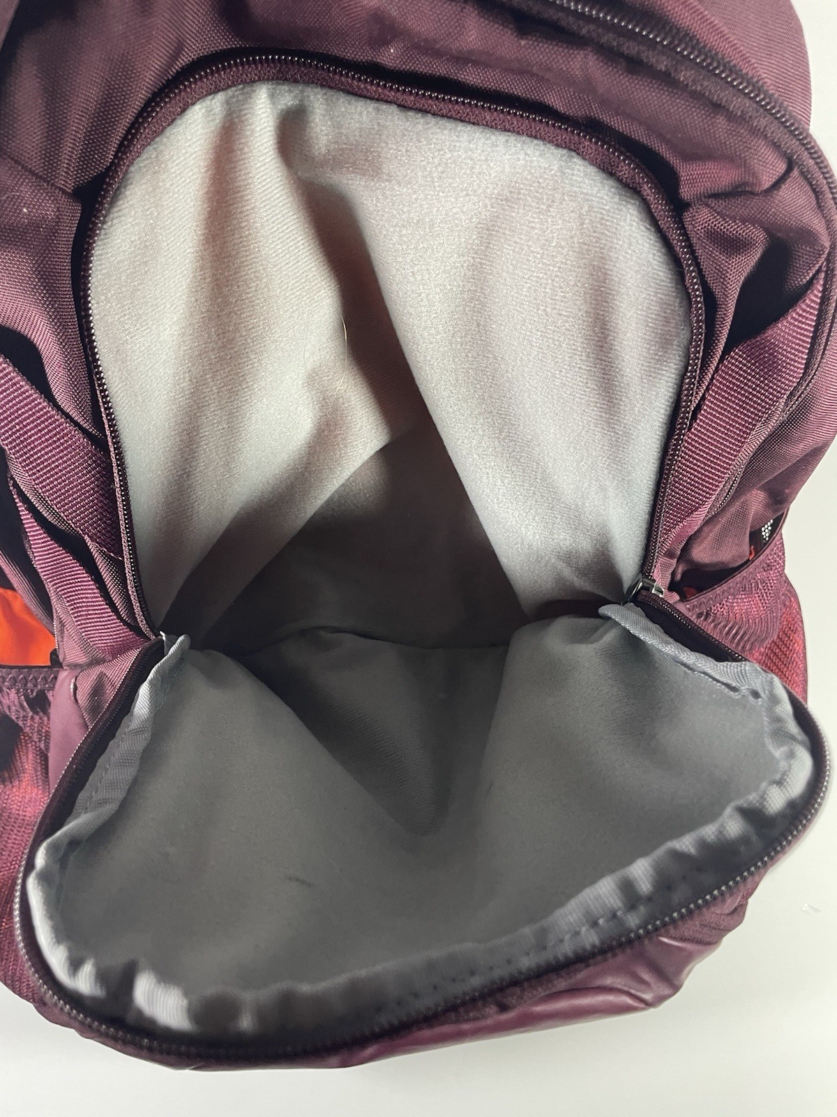 Under Armour Hustle 3.0 Backpack in the Dark Maroon and Orange colorway.