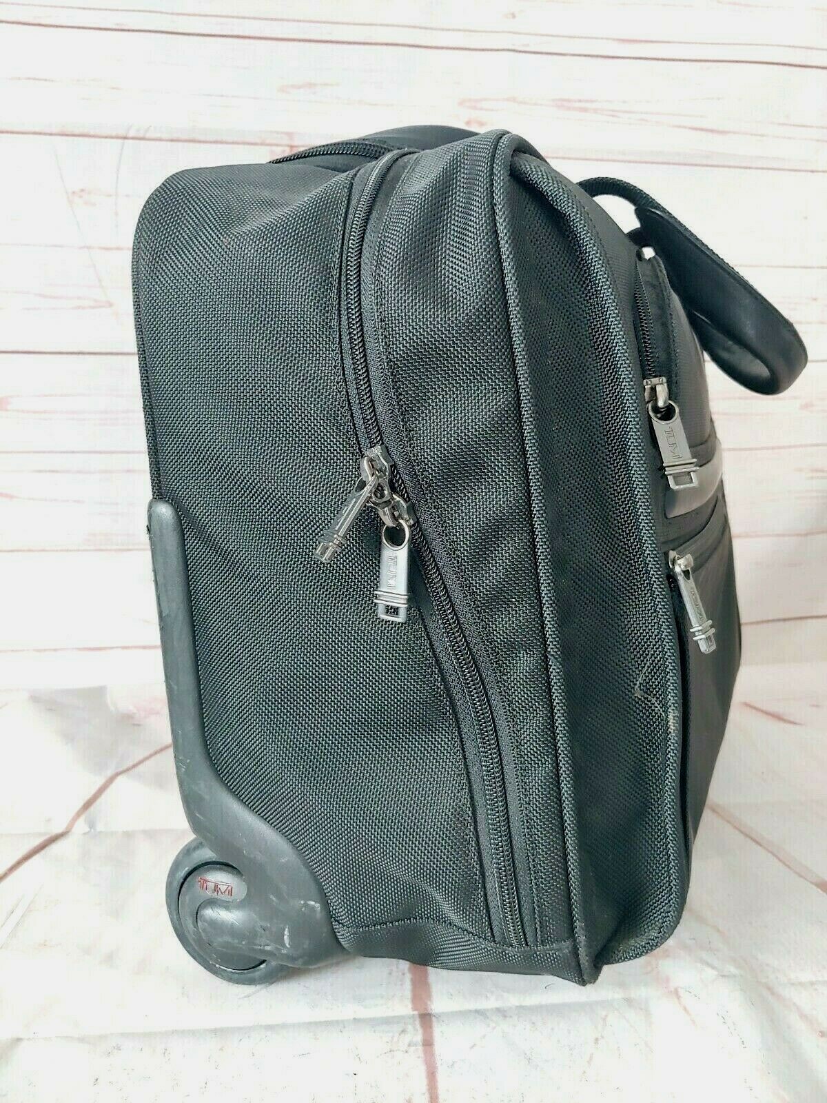 TUMI Black Wheeled Rolling Briefcase/Carry on Bag 15X13X6 Inches