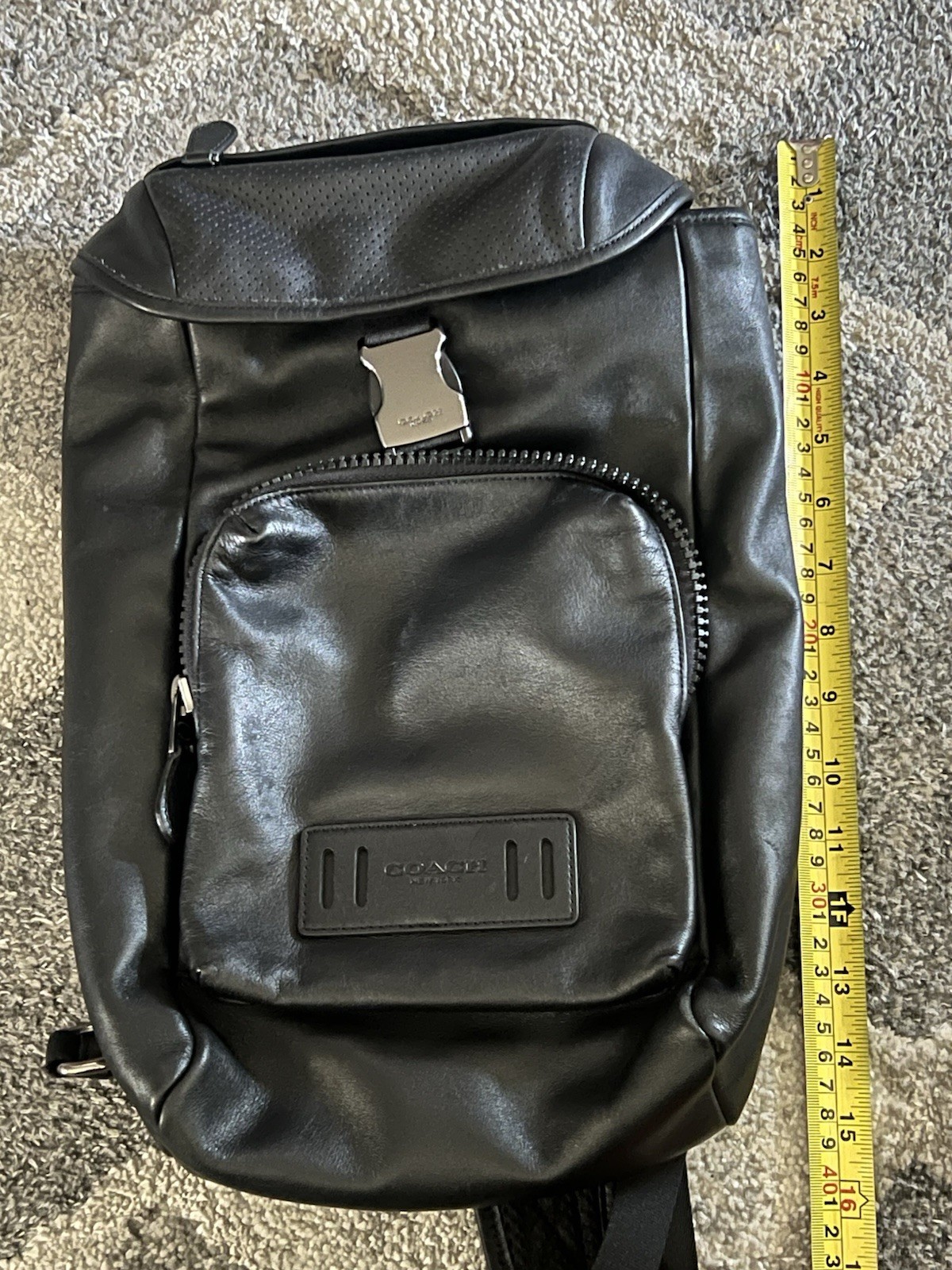 Coach Leather Sling Backpack well-organized, hands-free style, sleek design