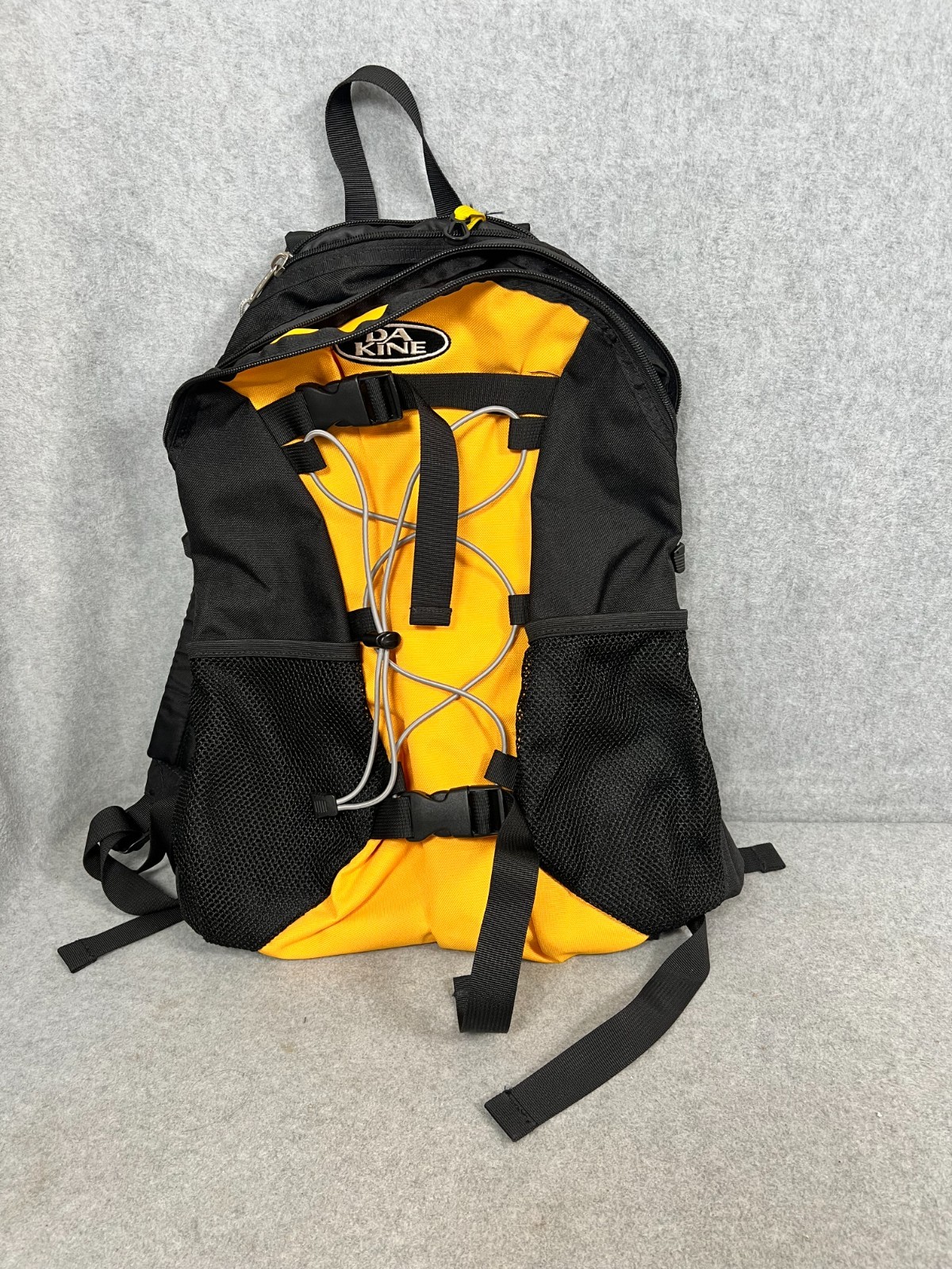 Dakine Black and Yellow Outdoor Backpack – Front Bungee Cord – Side Mesh Pockets