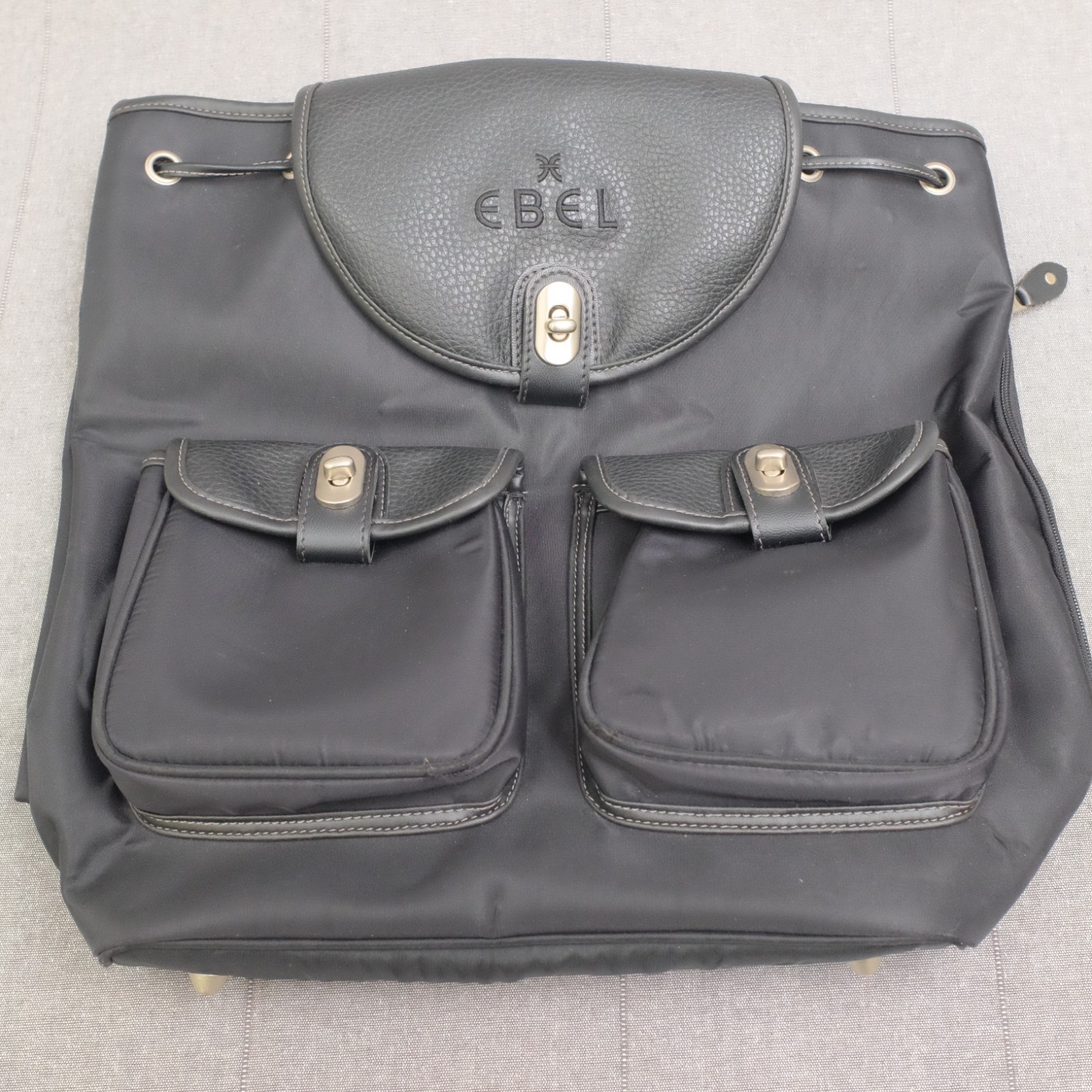 Ebel Black Nylon Faux Leather Turn Lock Cinch Top Travel Backpack