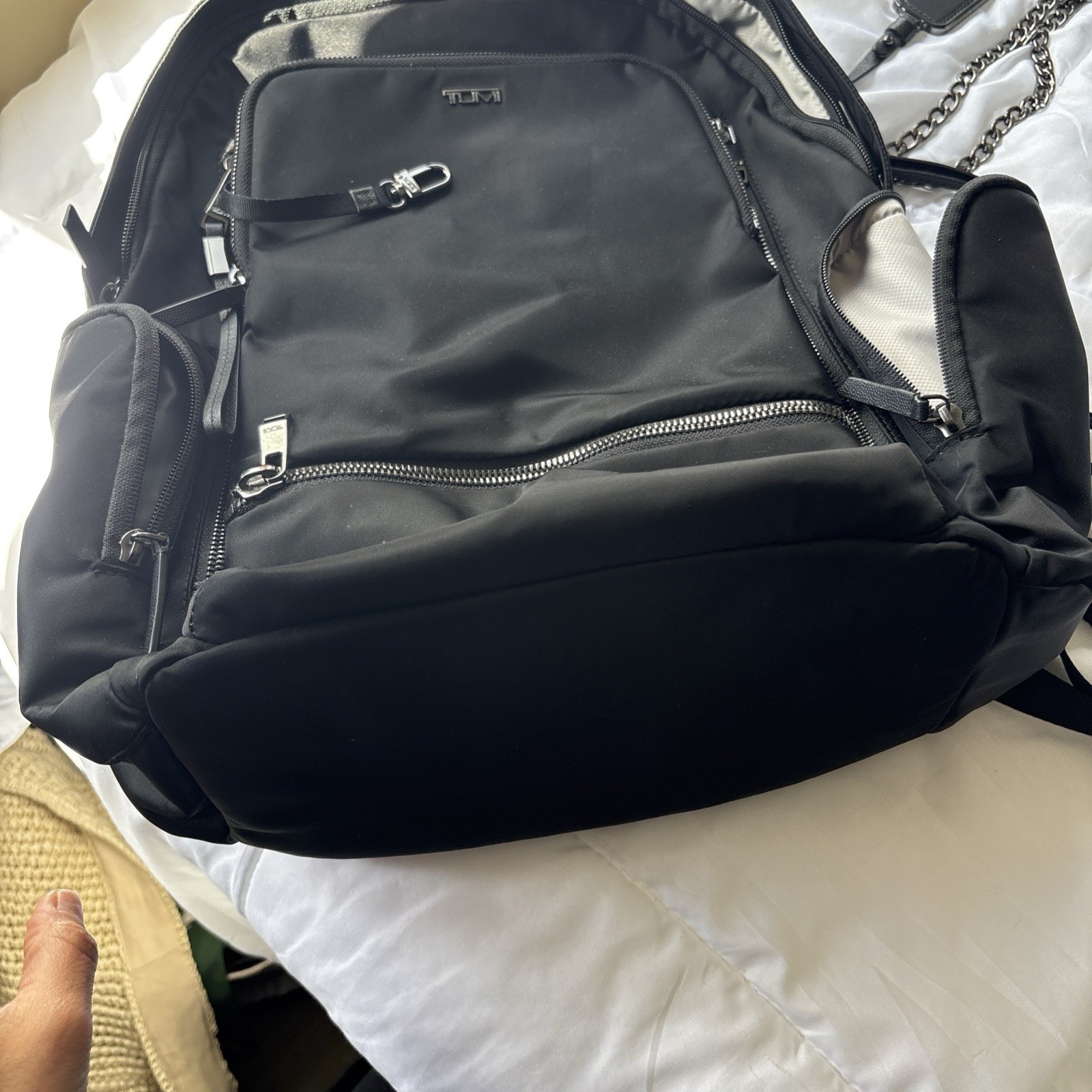 TUMI Black Backpack, Zip Closure, Adjustable Straps, Pockets, Top Handle