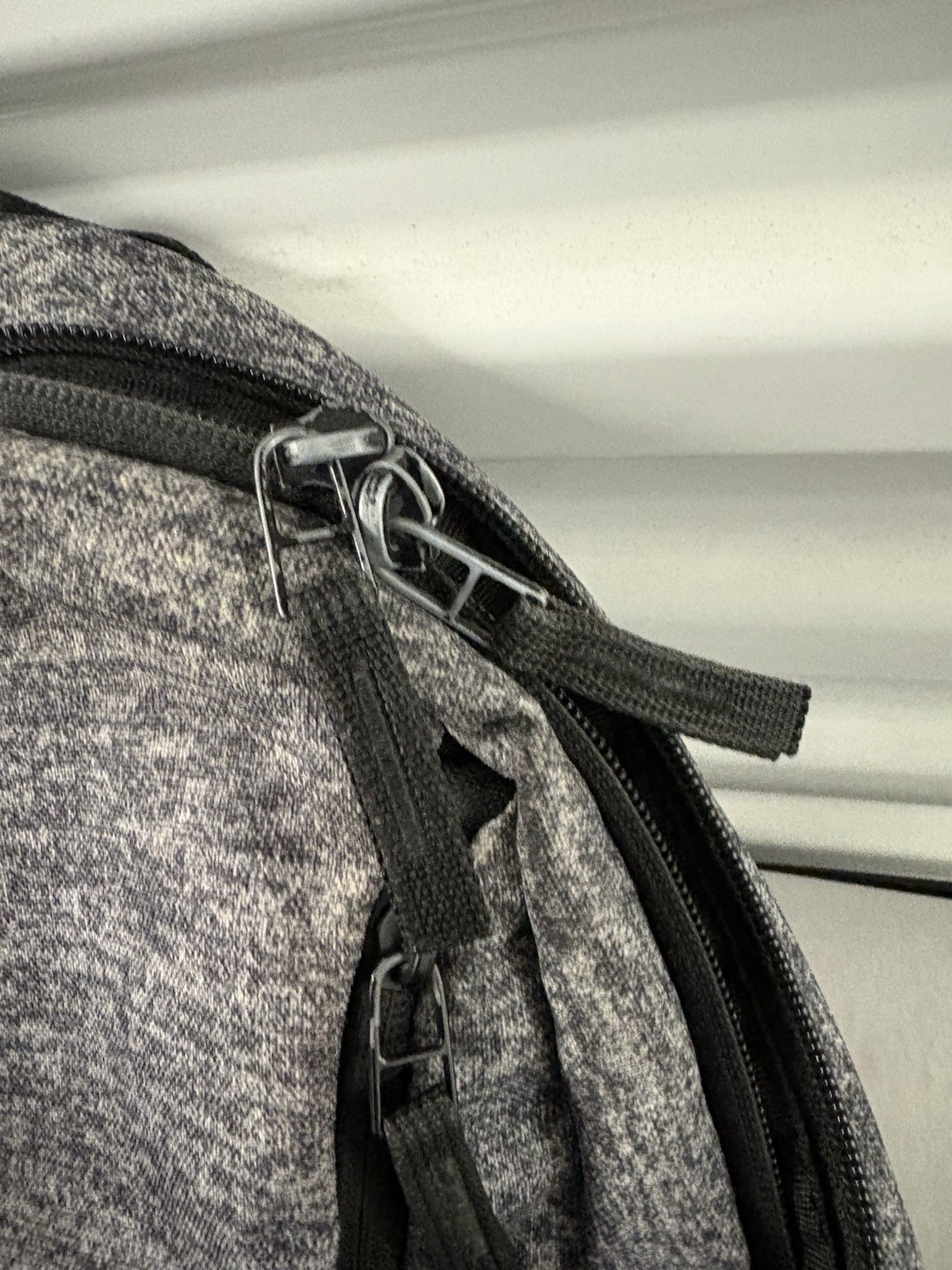 Adidas Defender backpack in grey heather material with black accents.